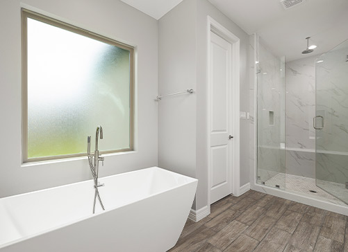 Modern bathroom design. Tub, bathtub and natural light coming through the window.