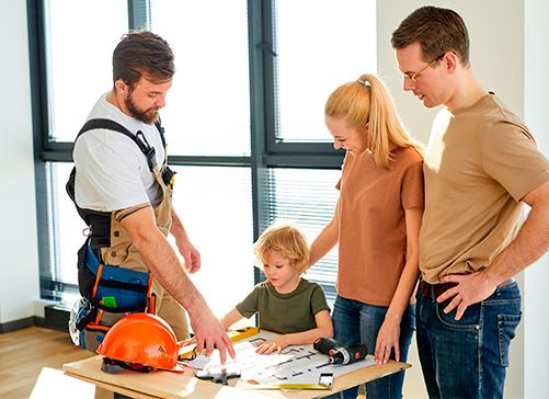  A family collaborates on a project, discussing options for custom versus pre-built homes to suit their lifestyle.