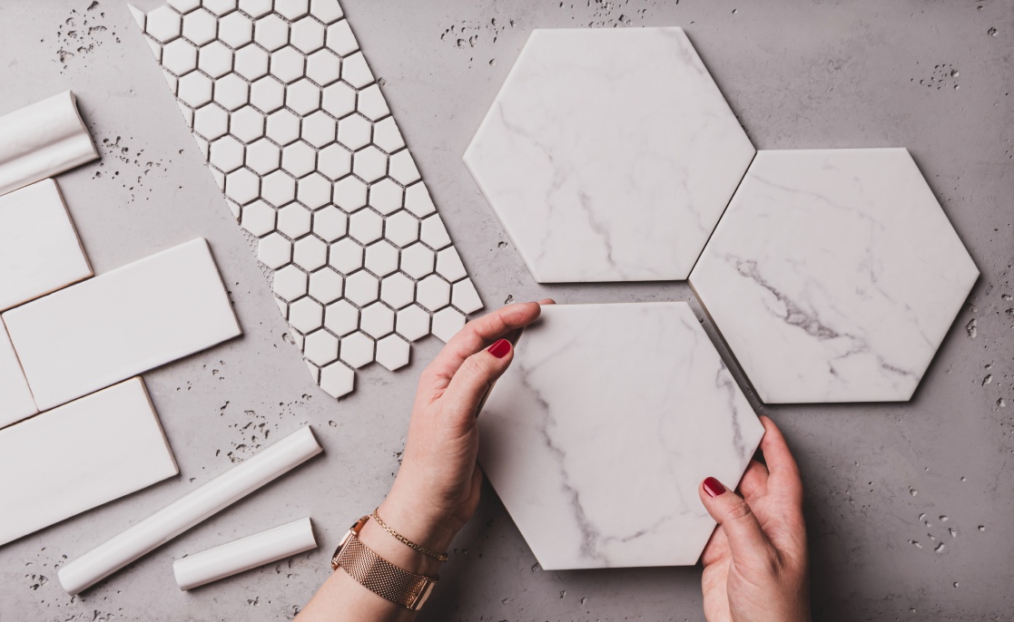 Interior design and home decoration - different shapes of white ceramic and gres tiles. Designer choosing bathroom or kitchen renovation materials. Captured from above (top view, flat lay).
