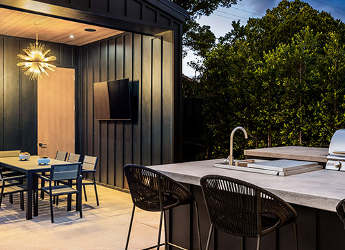 A bright kitchen with a dining table and chairs, illustrating a stylish space for family gatherings in Texas home renovations.
