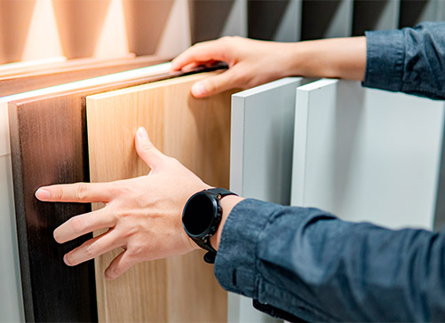 Person choosing material for home design