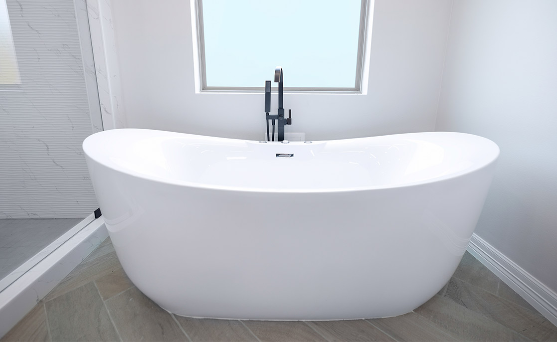 Spacious white bathtub in a stylish bathroom, highlighting luxury home upgrades and modern design elements.