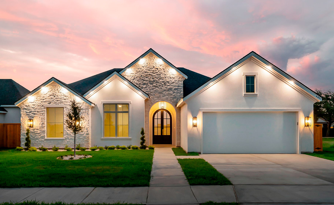 Villa Homes design: A beautiful white home with a large garage, featured in the context of Edinburg, TX.